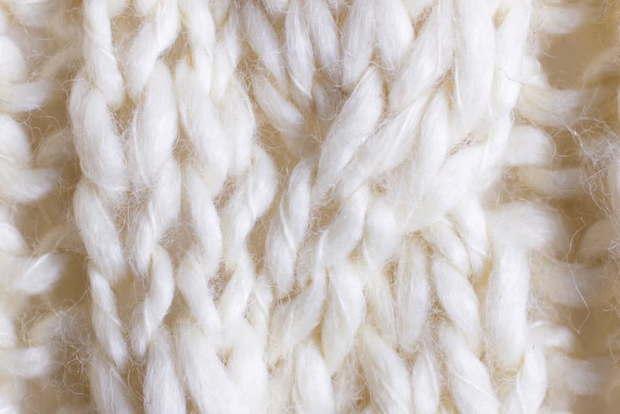 Wol met zachte, natuurlijke vezelstructuur in warme tinten, ideaal voor kussens, plaids, tapijten en meubelstoffering