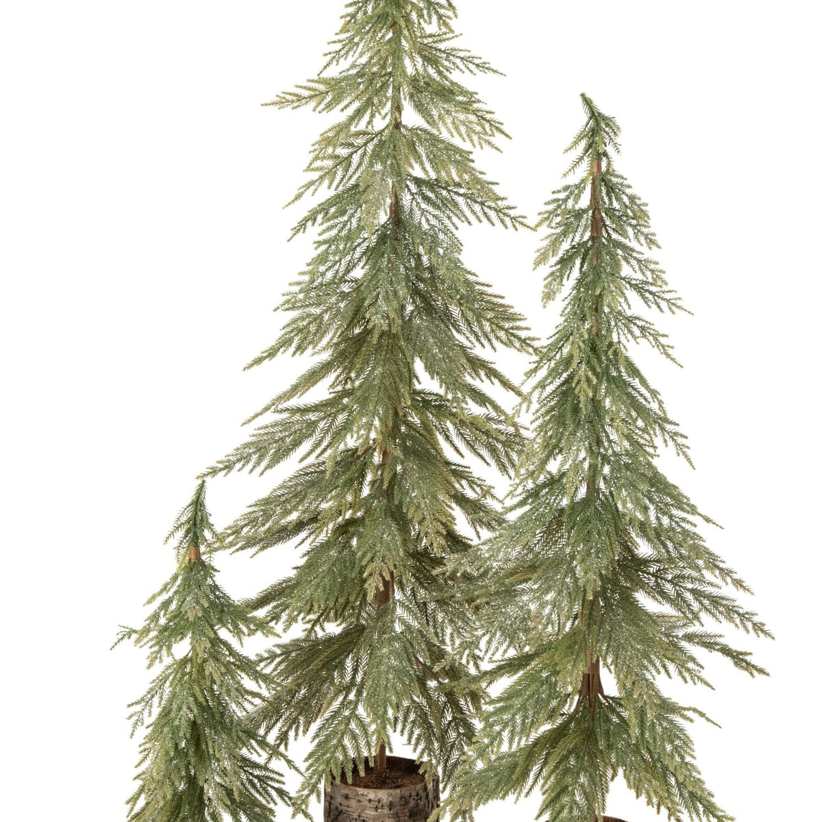 Twee slanke kerstbomen van J-Line op houten voet in een warme houten omgeving