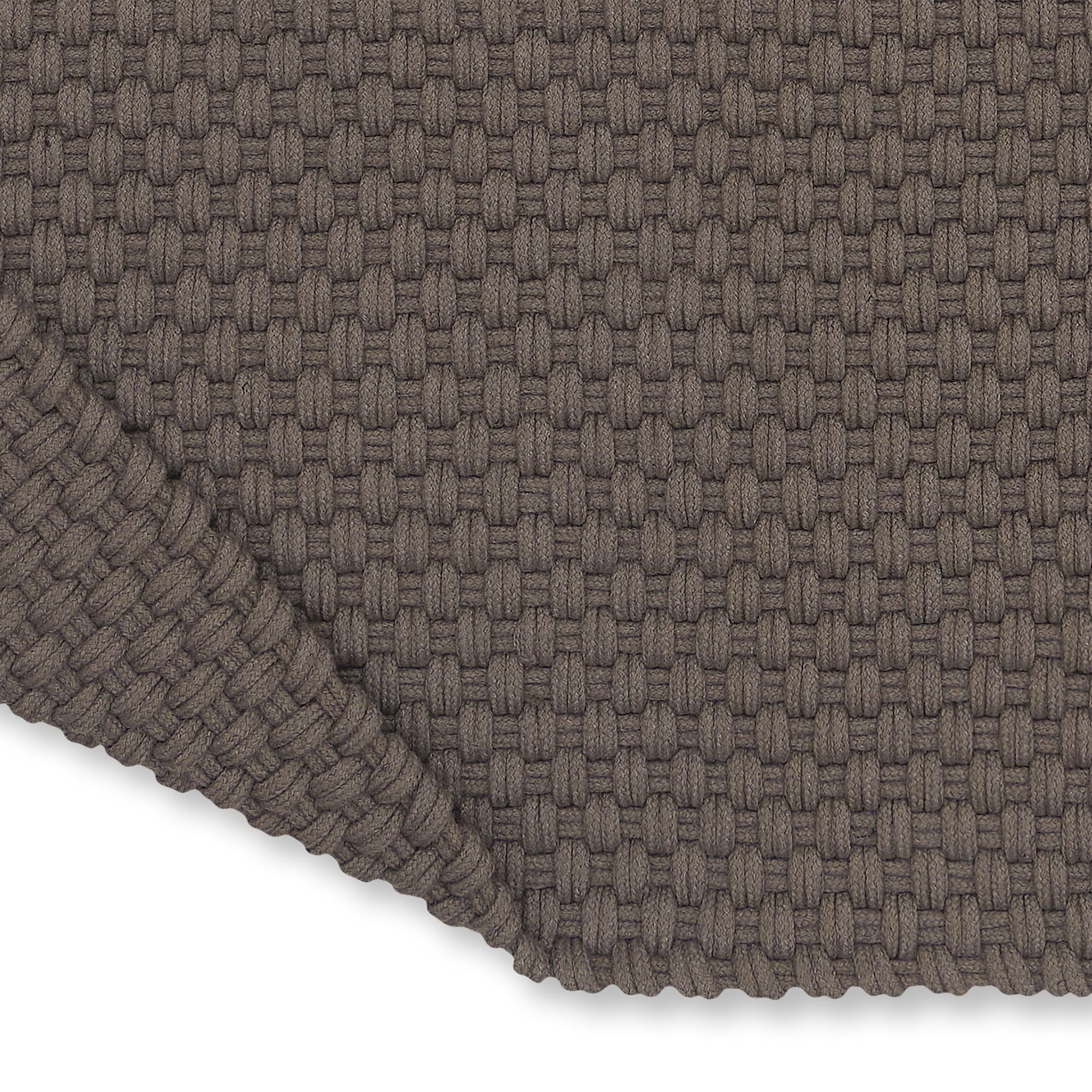 Detail van het weefsel van het grijstaupe Nomad outdoor vloerkleed