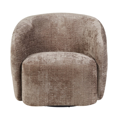 Fauteuil Yara Clay van Starfurn als leesplek bij het raam met een plaid over de armleuning