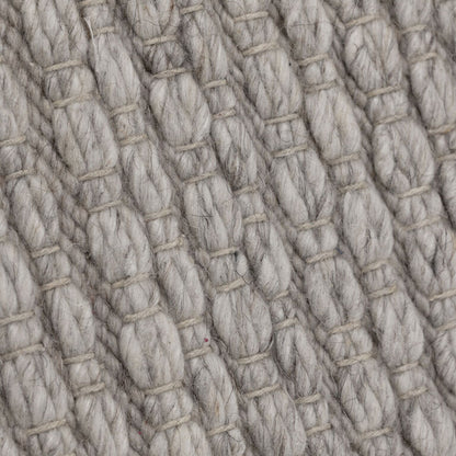 Close-up van de weving van het grijze Nirvana vloerkleed van MUST Living