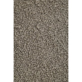 Close-up van de gemeleerde pool van het taupe Noble vloerkleed van MUST Living